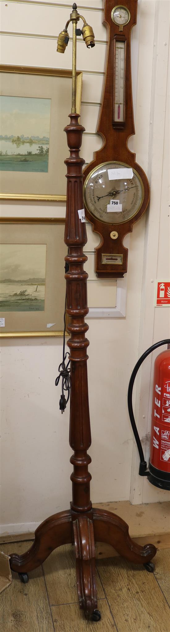 A mahogany lamp standard